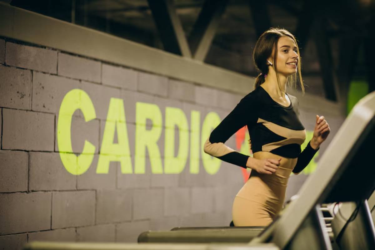 A woman jogs on a treadmill in a gym, with a bright green 