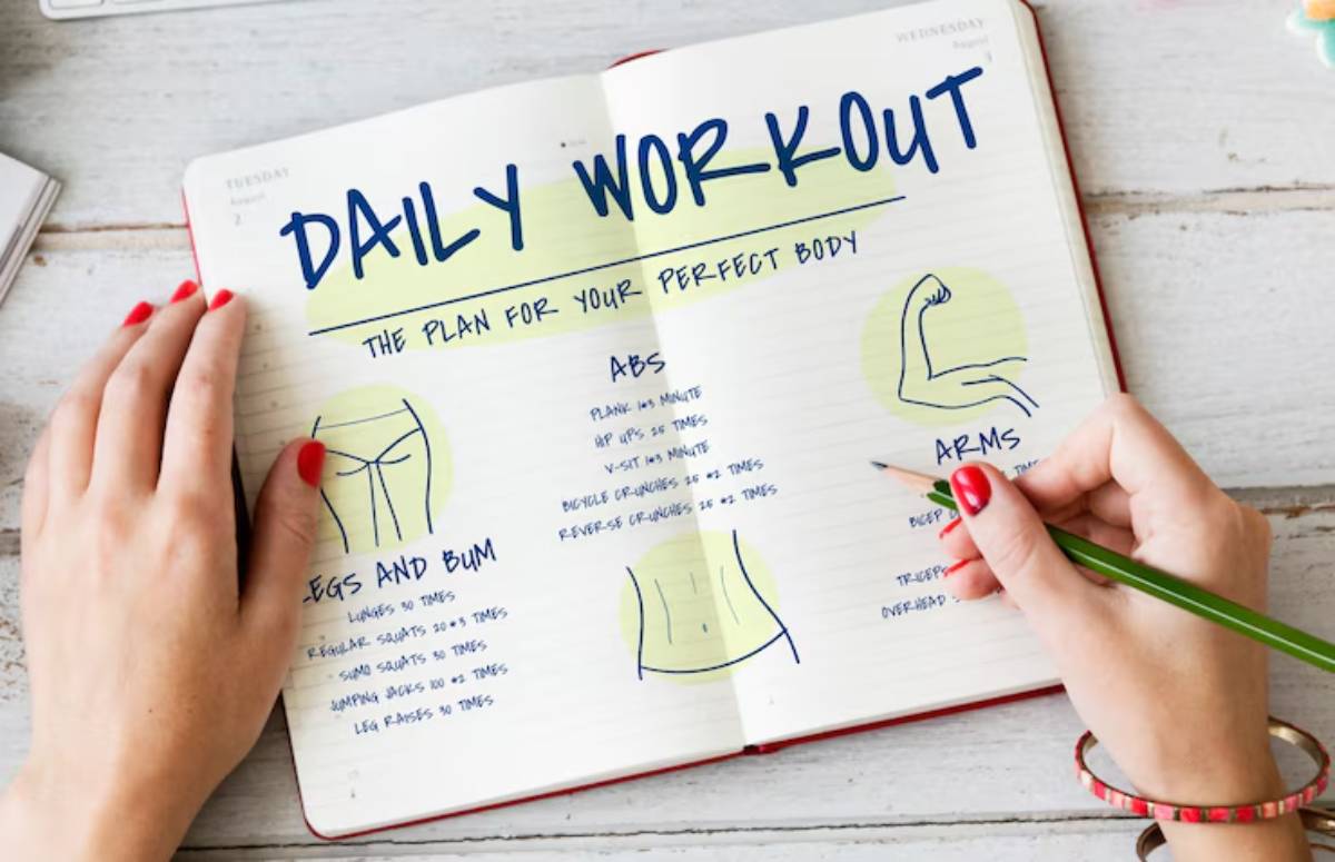 A person writes in a notebook titled 
